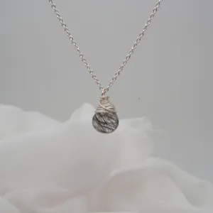 Tourmalinated quartz pendants